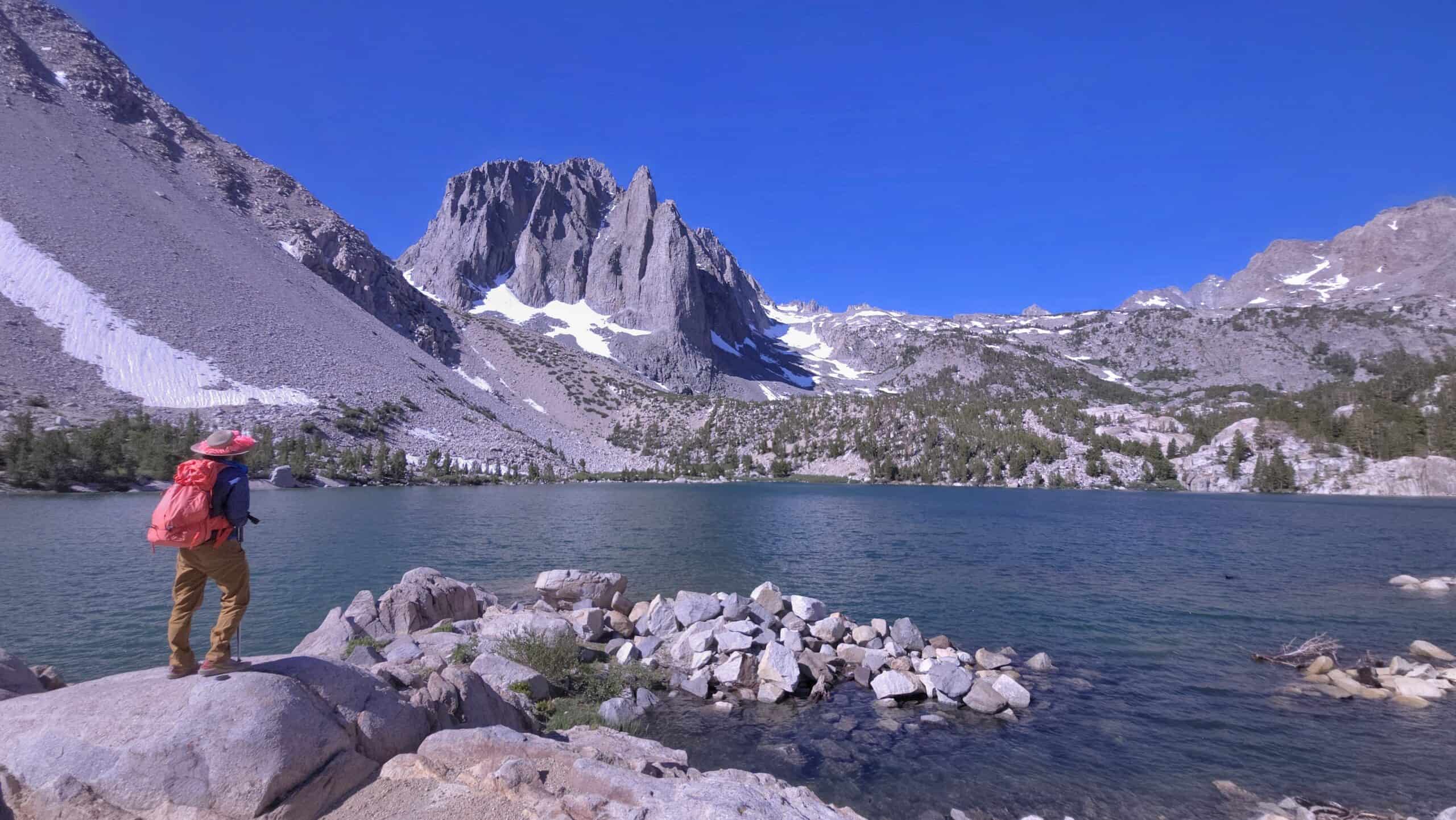 Hiker standing in front of Temple Crag