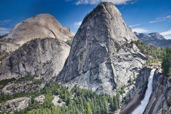 Hiking into Yosemite Valley with views of Half Dome and Nevada Falls